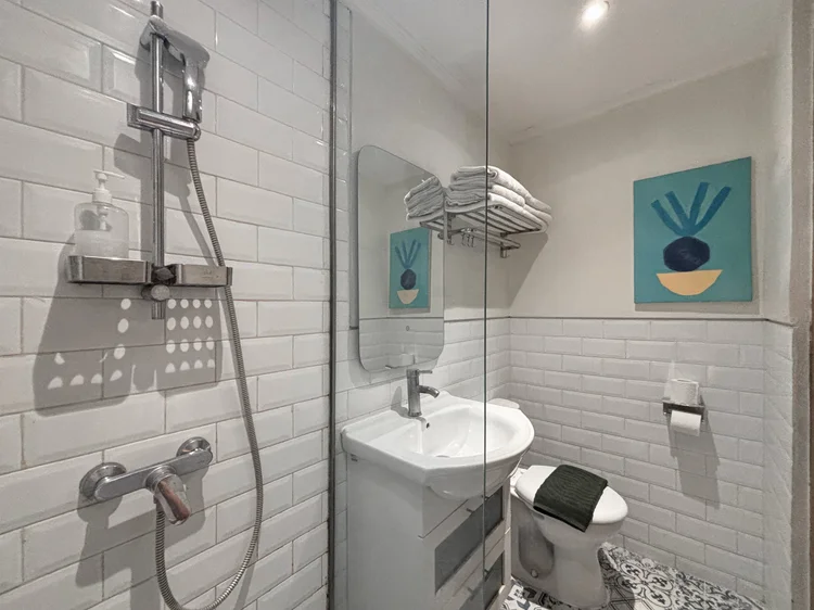 Santorini: Hot-water shower and basin, cleaned by our own trained team to CHSE standard before every check-in.