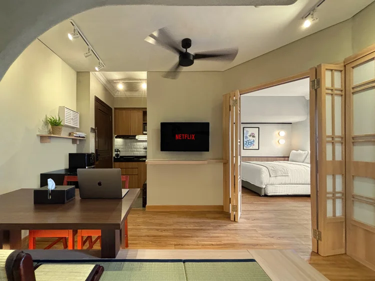 Nakameguro: A tatami-style dining table for four, smart TV with Netflix across from it.