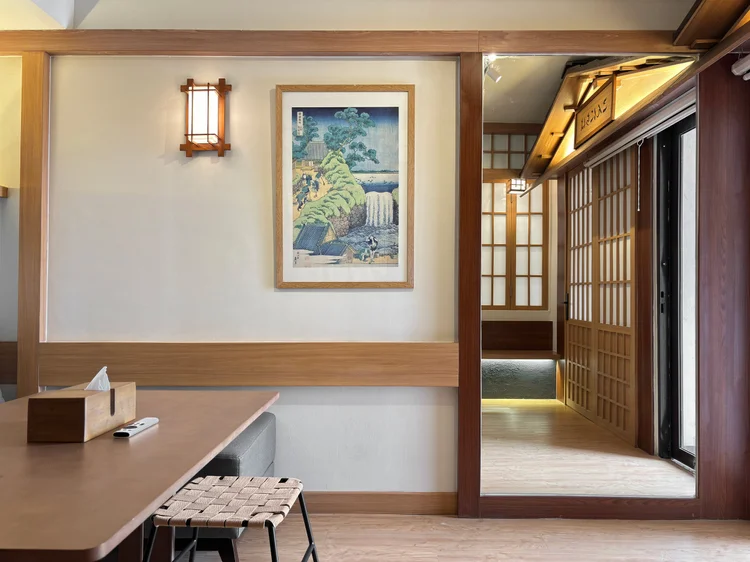 Kawaguchi: The dining table by the door to the small balcony, framed by shoji panels.