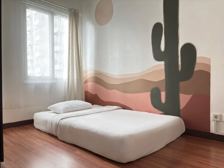 Namibia: Cactus and desert mural: the African theme runs right up the bedroom wall.