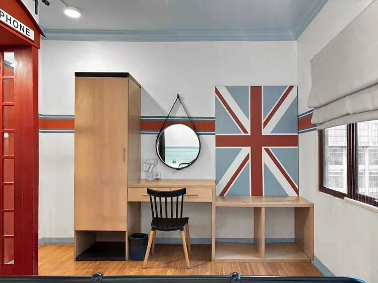 London: A dressing table and wardrobe in this bedroom, with a mirror and a British flag accent.