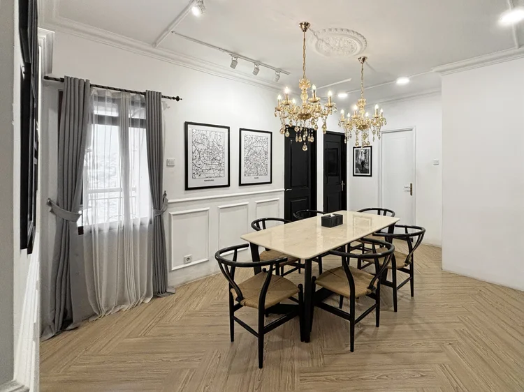 Paris: The dining table by the balcony doors. Sleeps 9, up to 12 with extra beds.
