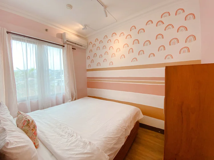 Madison: The same bedroom from the other side: wardrobe and rainbow wall.