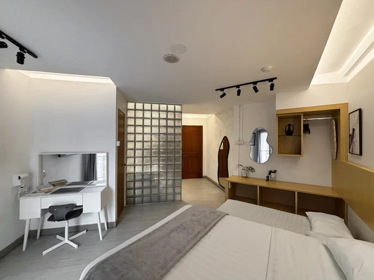 Sydney: A white dressing table beside the bed, enough for a laptop or the evening skincare.