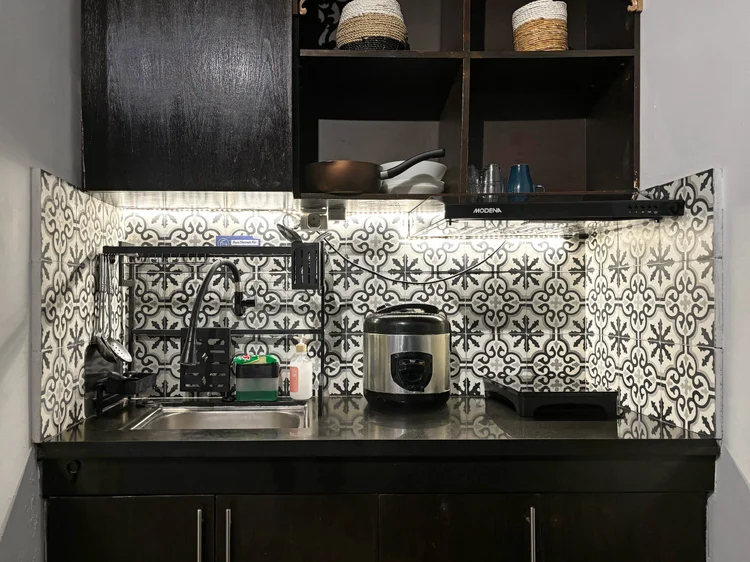 Marrakech: Open kitchen with rice cooker and patterned tiles; basic cooking tools are there.
