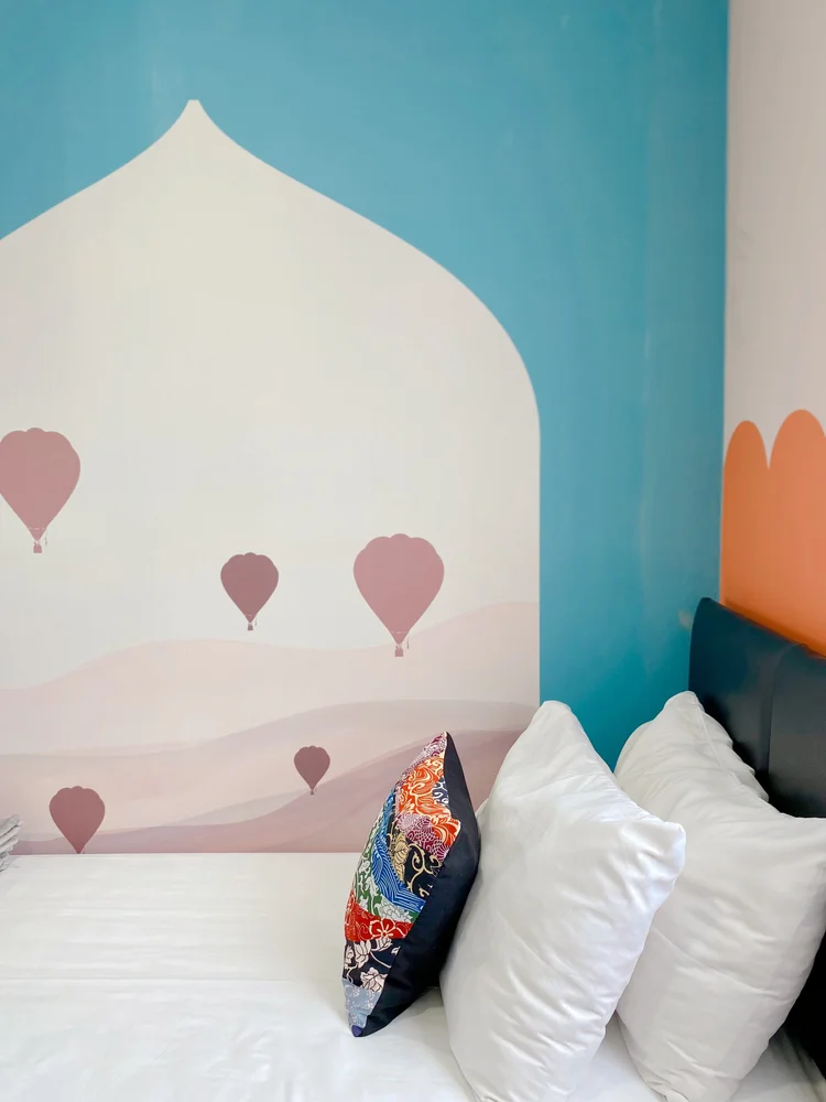 Cappadocia: A Cappadocia-style hot air balloon mural above the bed.