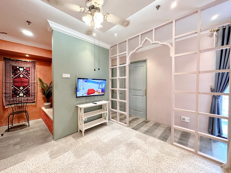 Cappadocia: Smart TV with Netflix behind the patterned wooden screens, facing the sofa.