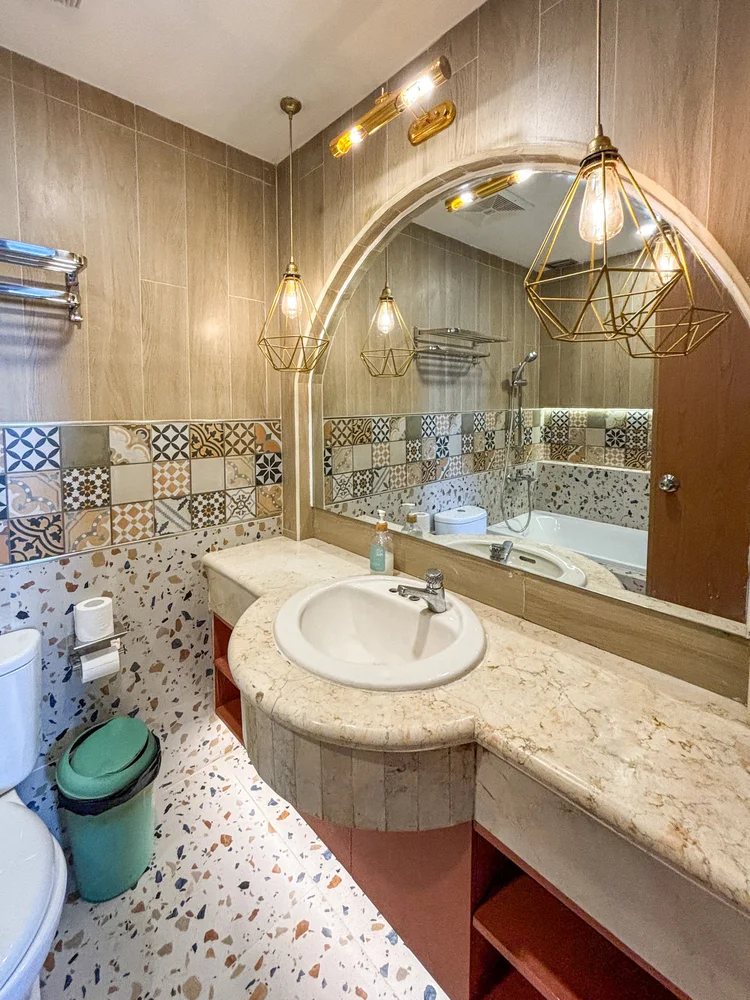 Havana: Bathroom with a granite sink and terrazzo flooring.