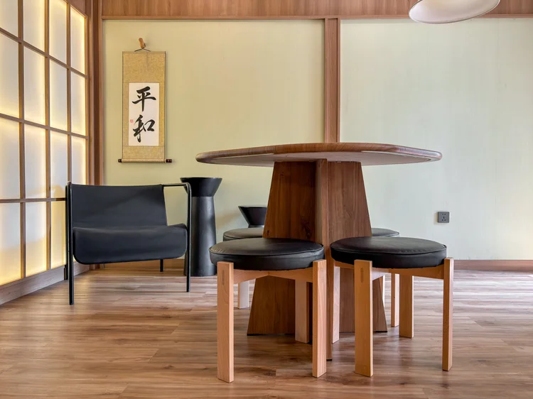 Sapporo: The corner armchair with nesting tables, for a coffee or a quiet read.