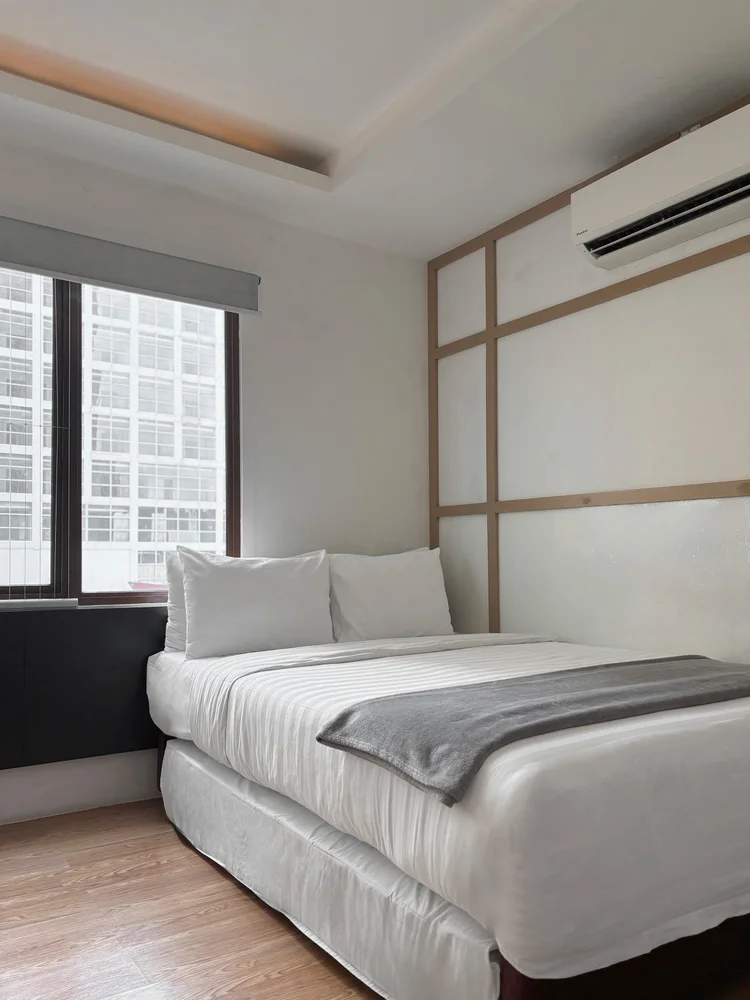 Shibuya: Sleeping area: a sliding small double bed with AC and a window.