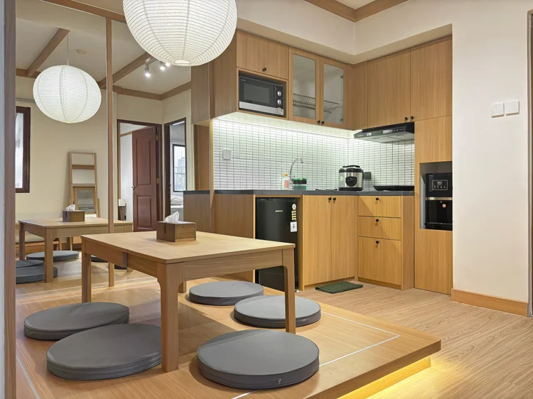 Nara: A low dining table for five with floor cushions, Japanese-house style.