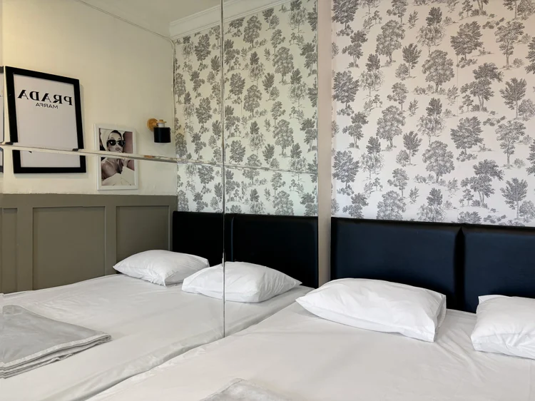 Florence: Sliding small double beds in the master bedroom, pushed together or apart as needed.