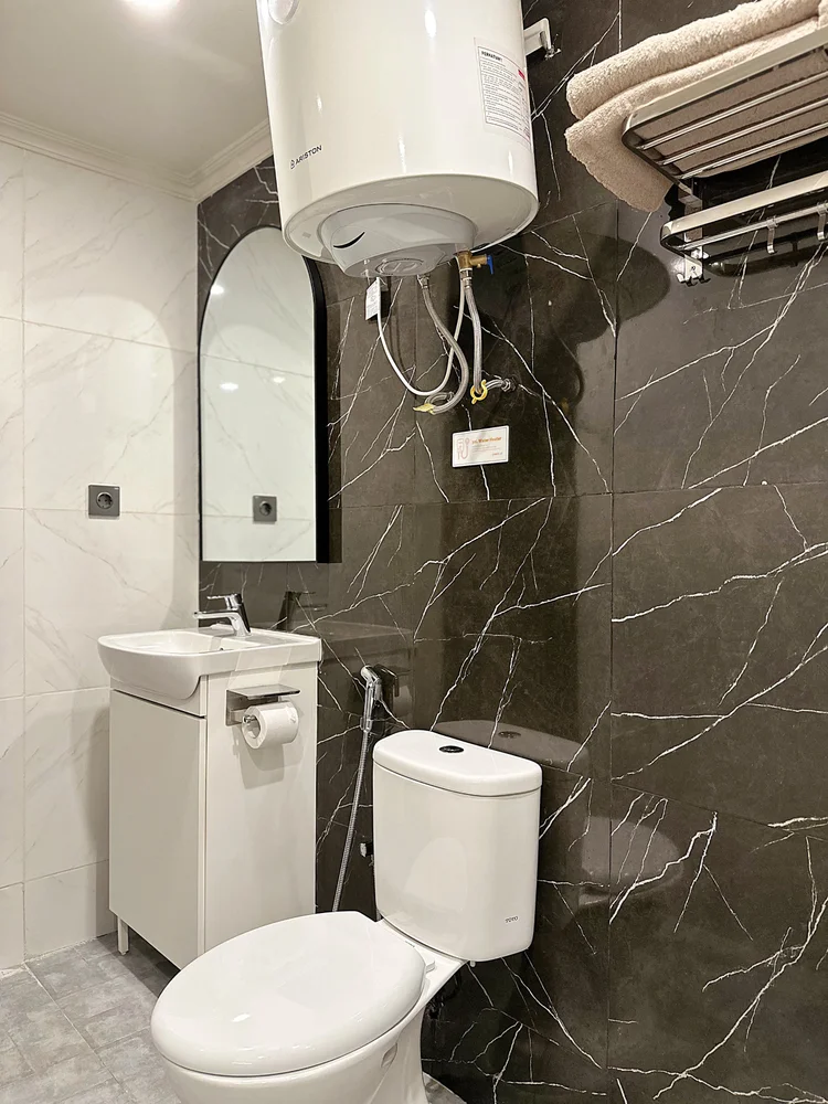 Boston: Water heater in the bathroom. The gym downstairs is free for guests, warm shower after.