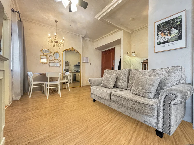 Bordeaux: Living and dining in one room, French countryside style, with a chandelier overhead.
