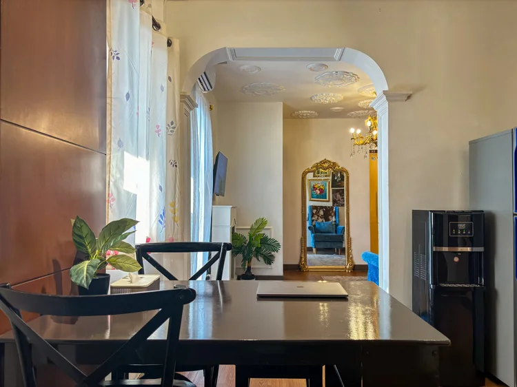 Marseille: A four-person dining table with chairs, on the kitchen side.