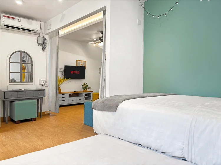 St. Tropez: Sleeps 5, up to 6 with extra beds; the bed area has AC, the living room beyond.