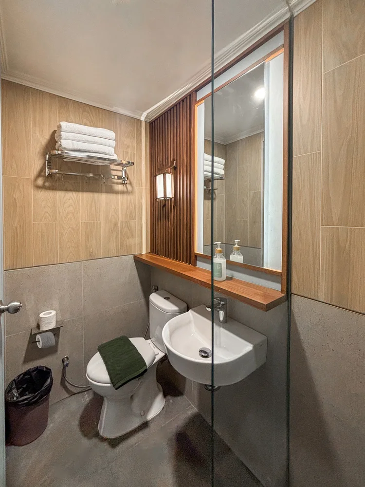 Shinjuku: Modern bathroom with toilet and basin; the same soap and shampoo in every unit.