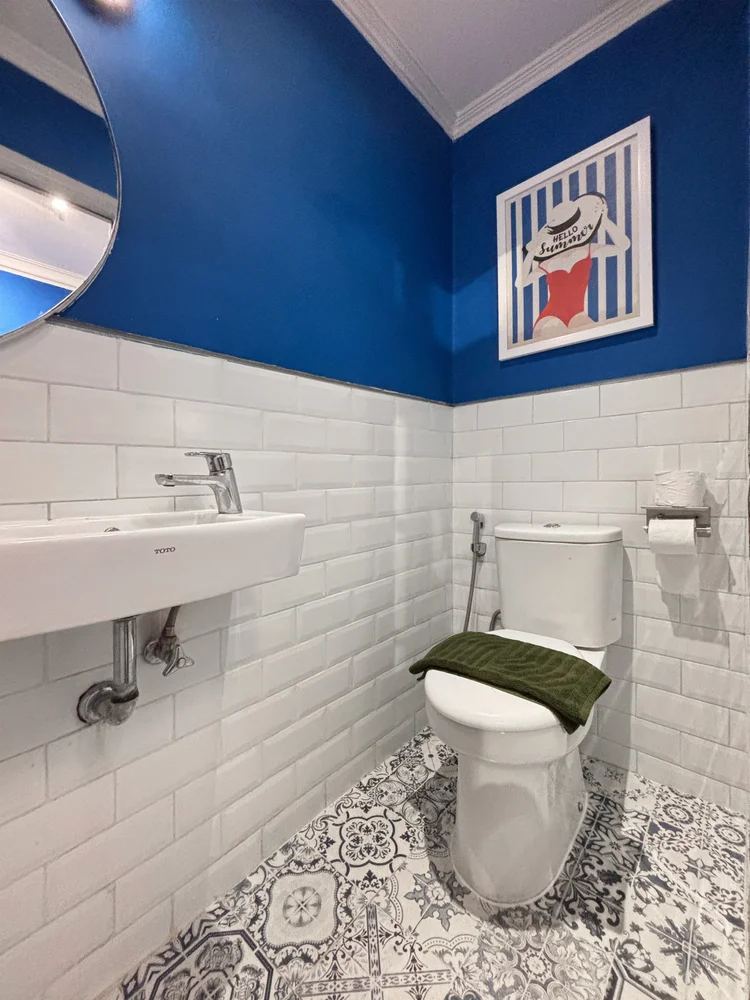 Santorini: The small bathroom off the bunk-bed room: basin and toilet, blue walls.