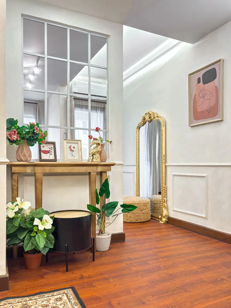 Provence: Console table and a tall gold-framed mirror, true to the Parisian theme.