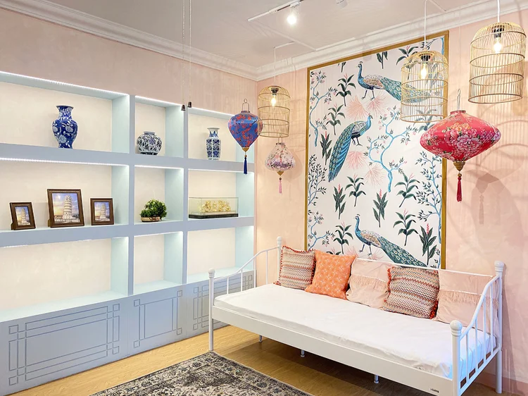 Malacca: Peranakan-style living room: a day bed to lounge on and shelves of ceramics.