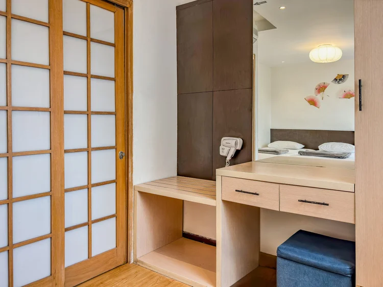 Yokohama: Sliding shoji doors open onto a dressing table with a mirror and room phone.