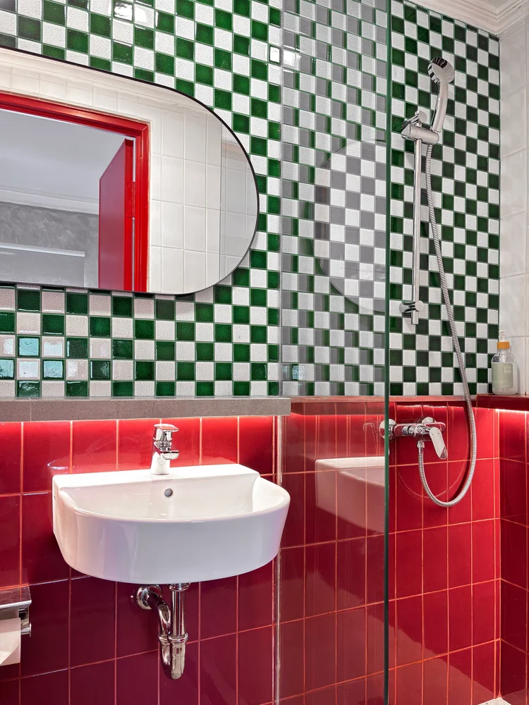Miami: A hot-water shower with green and red checkerboard tiles.