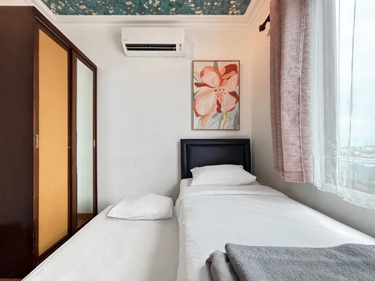 Beverly: The same room, with its own AC and a wardrobe.