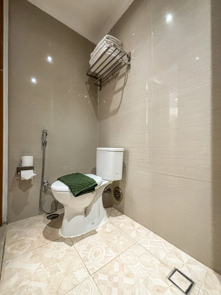 Vienna: Toilet with patterned floor tiles, cleaned by our own trained team to CHSE standard before every check-in.