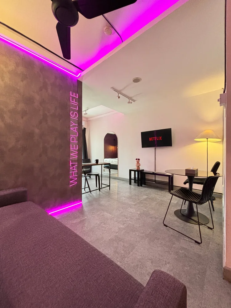 Copenhagen: Smart TV and a work desk under the neon strip, in the same room as the sofa.