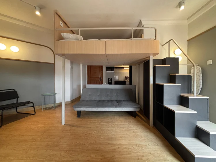 Den Haag: Stairs up to the loft bed, with a window beside it. Booking direct here is usually the lowest price for the same unit.
