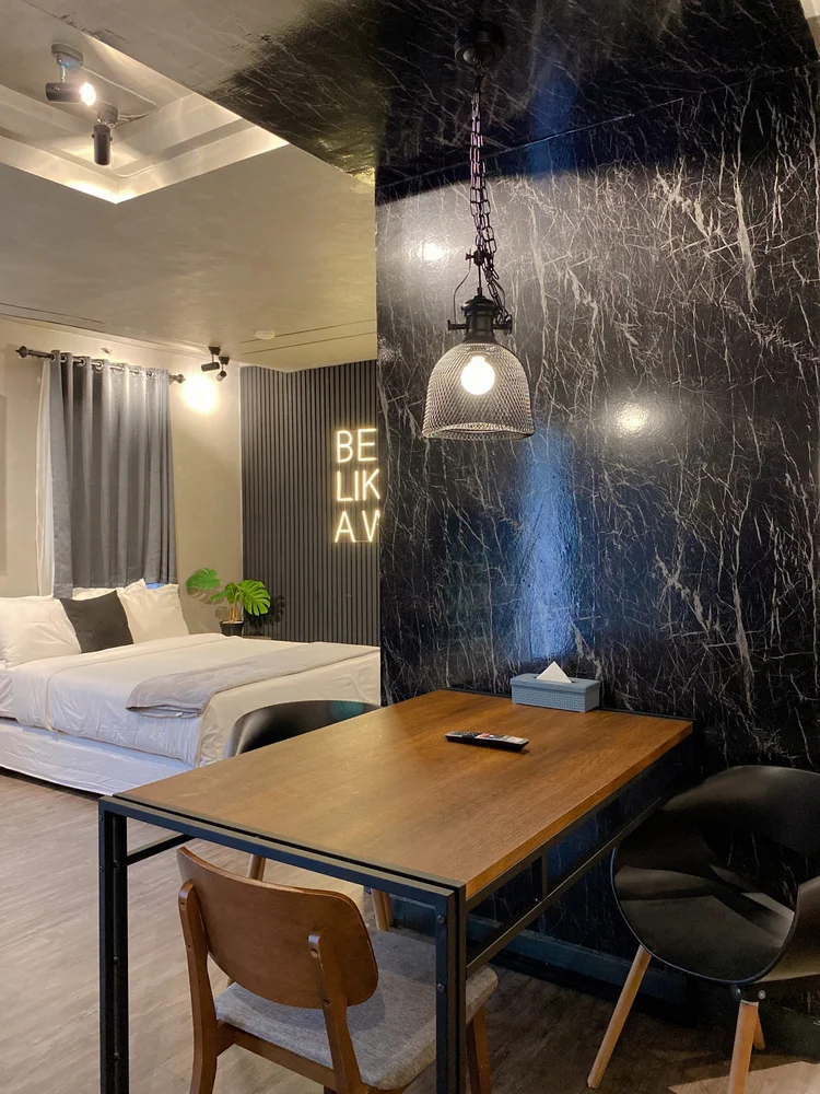 Kingston: A four-person dining table beside the bed, good for working too.