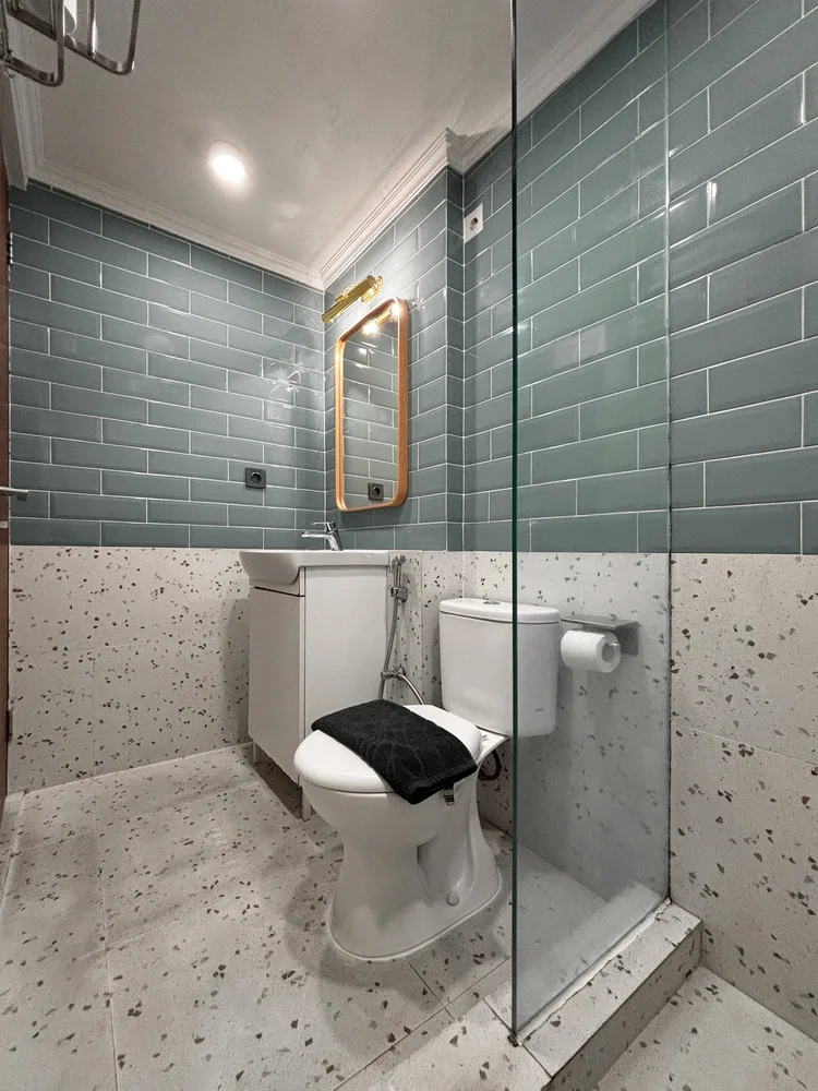 Madagascar: A modern bathroom with a hot shower; soap and shampoo are stocked.