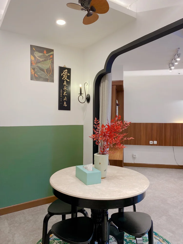 Saigon: A round dining table for four with stools, right for breakfast together.