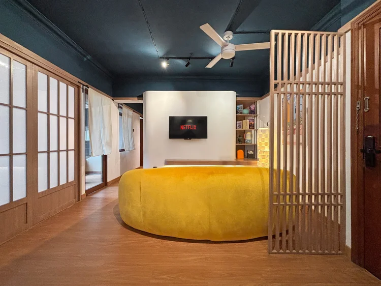 Kyoto: Japanese-style sliding panels frame the living room, with the Netflix smart TV at its center.