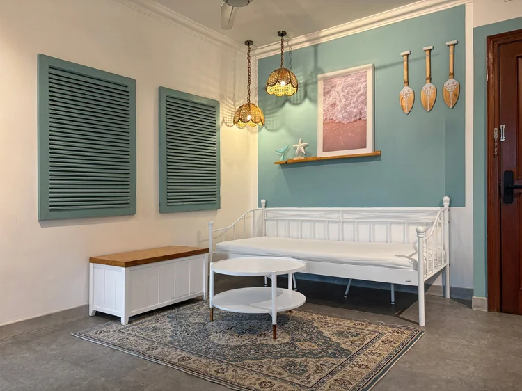 Mykonos: A three-seater sofa under the ceiling fan, where everyone gathers after a day out.
