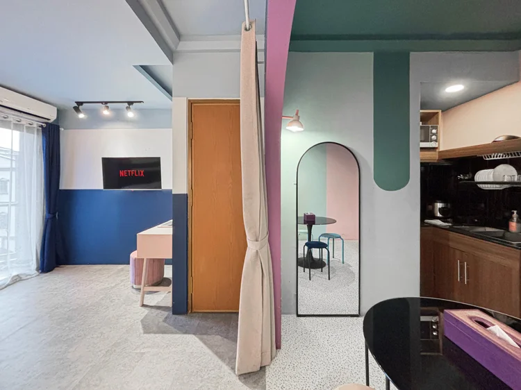 Montreal: Sleeps 4, up to 5 with extra beds: kitchen, bed area and a full-length mirror in one room.