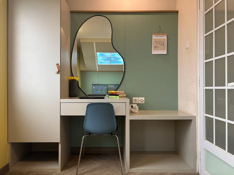 Seoul: Dressing table with a curvy mirror and a blue chair, enough for a spell of laptop work.
