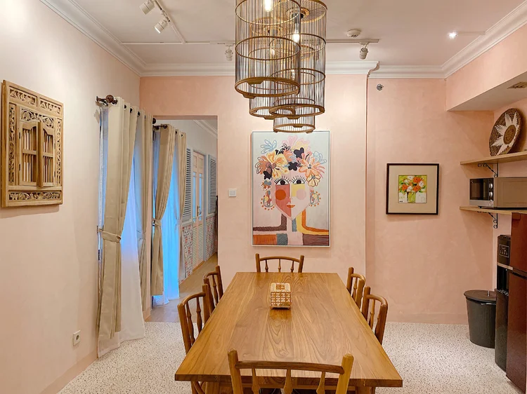 Malacca: A dining table for six, under the birdcage lamps.