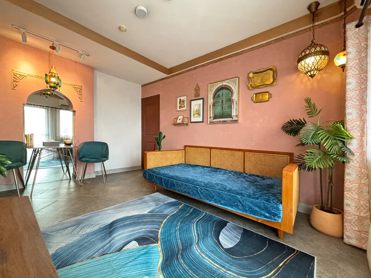 Marrakech: Marrakech's living room: a rattan day bed with blue velvet and Moroccan lanterns.
