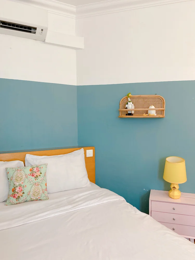 Madison: A bedside lamp and small drawers, enough for your phone and a book.