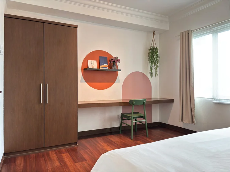 Namibia: Wardrobe and a table with a green chair, right beside the window.