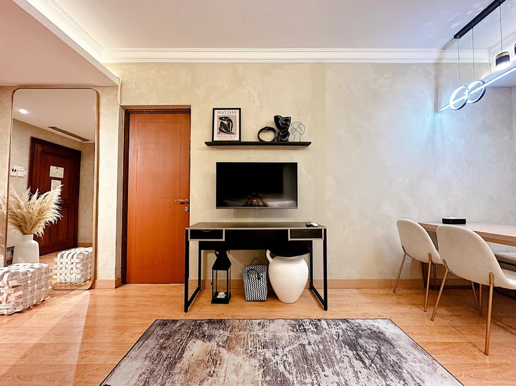 Amalfi: The dining table sits right by the living area, so meals stay in one room.