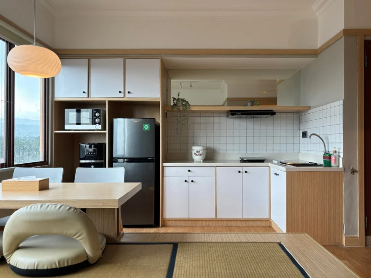 Fukuoka: Open kitchen with fridge, microwave, induction stove and rice cooker.