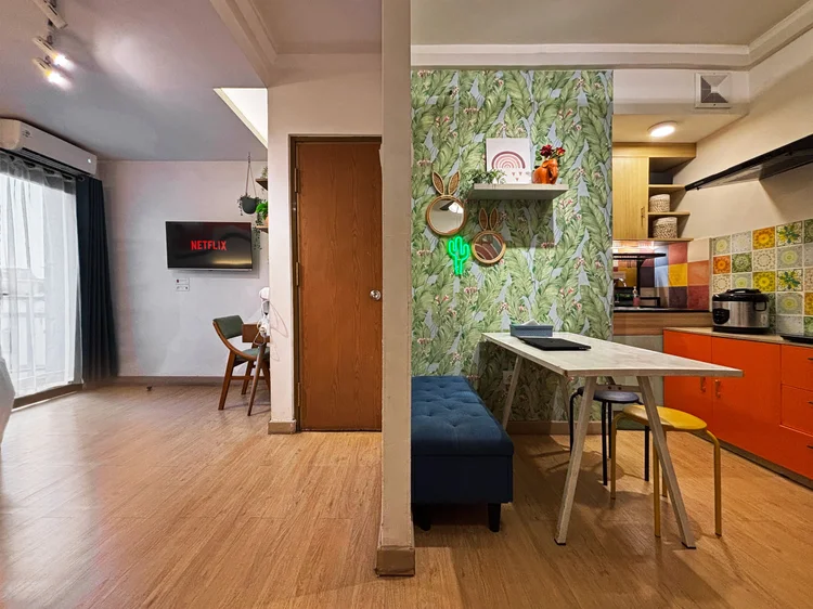 Barbados: Colorful Bohemian: orange kitchen, tropical wallpaper and a mountain mural, in a studio that sleeps 4.