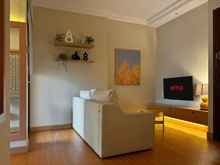 Nami: The living room: a sofa bed facing the smart TV with Netflix.