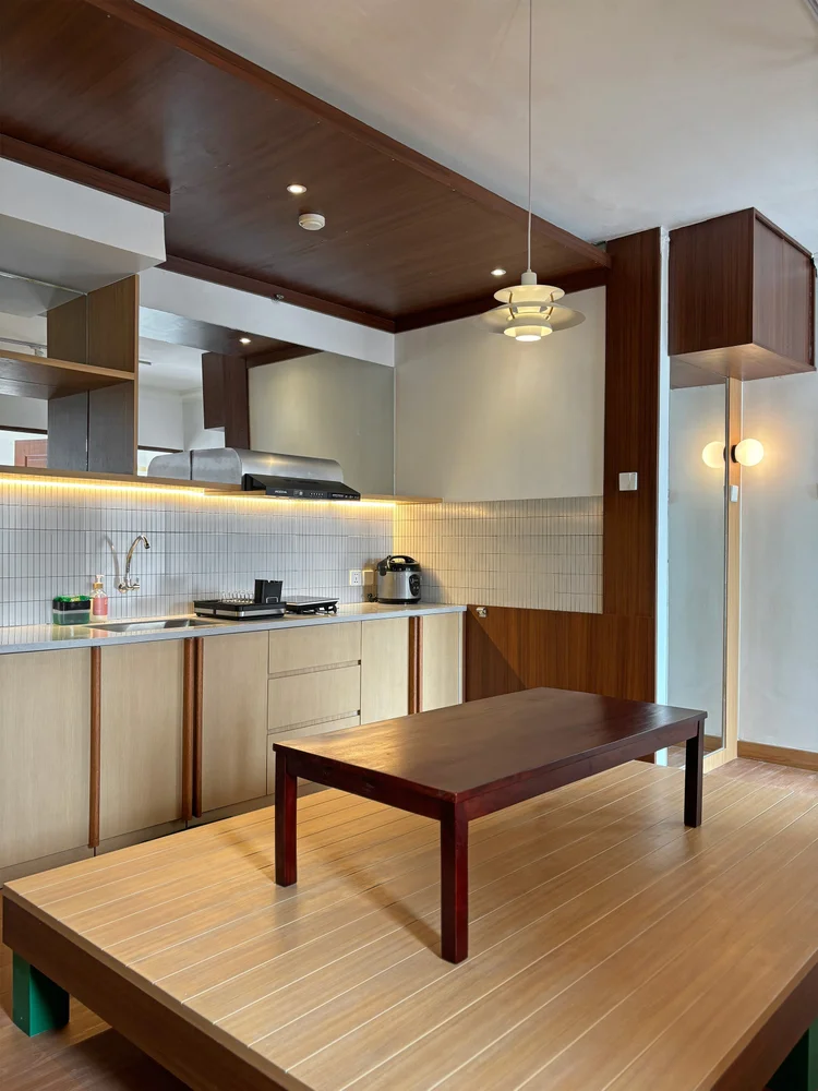 Incheon: Open kitchen with induction stove, fridge, microwave and rice cooker.