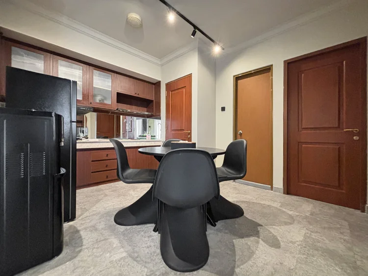 Saitama: Dining table for four with black chairs, next to the fridge and open kitchen.