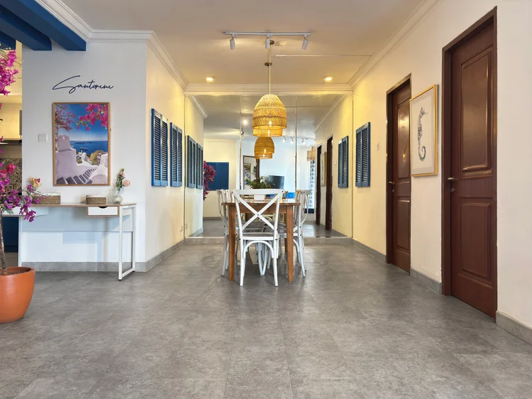Santorini: The hallway to the four bedrooms, the dining area at the bright end.