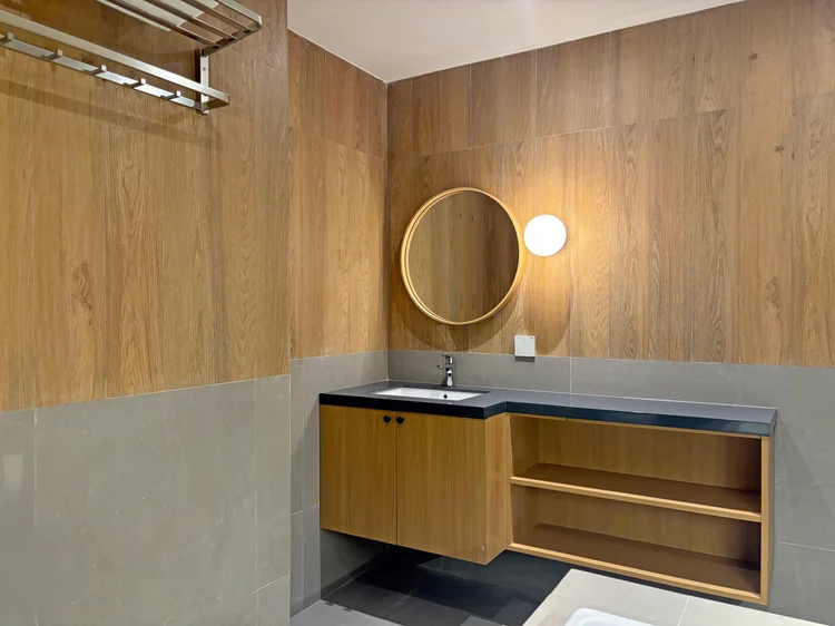 Nara: Basin with round mirror; soap and shampoo the same in every unit.