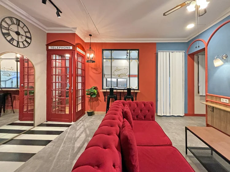London: A red London telephone booth replica is a signature piece in the living room.